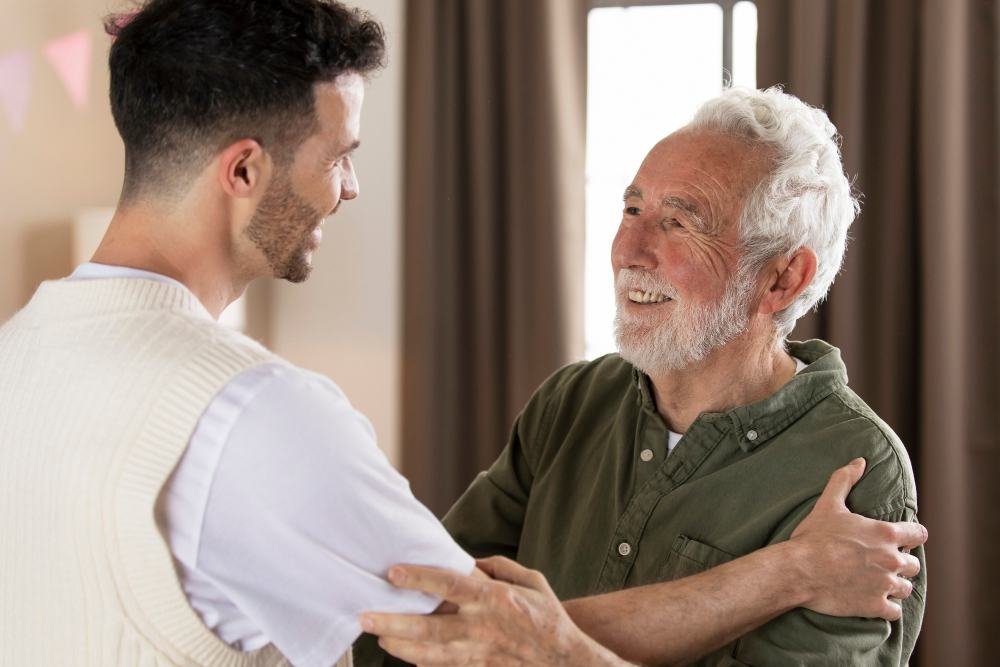 Caregiver sharing a warm moment with an elderly client